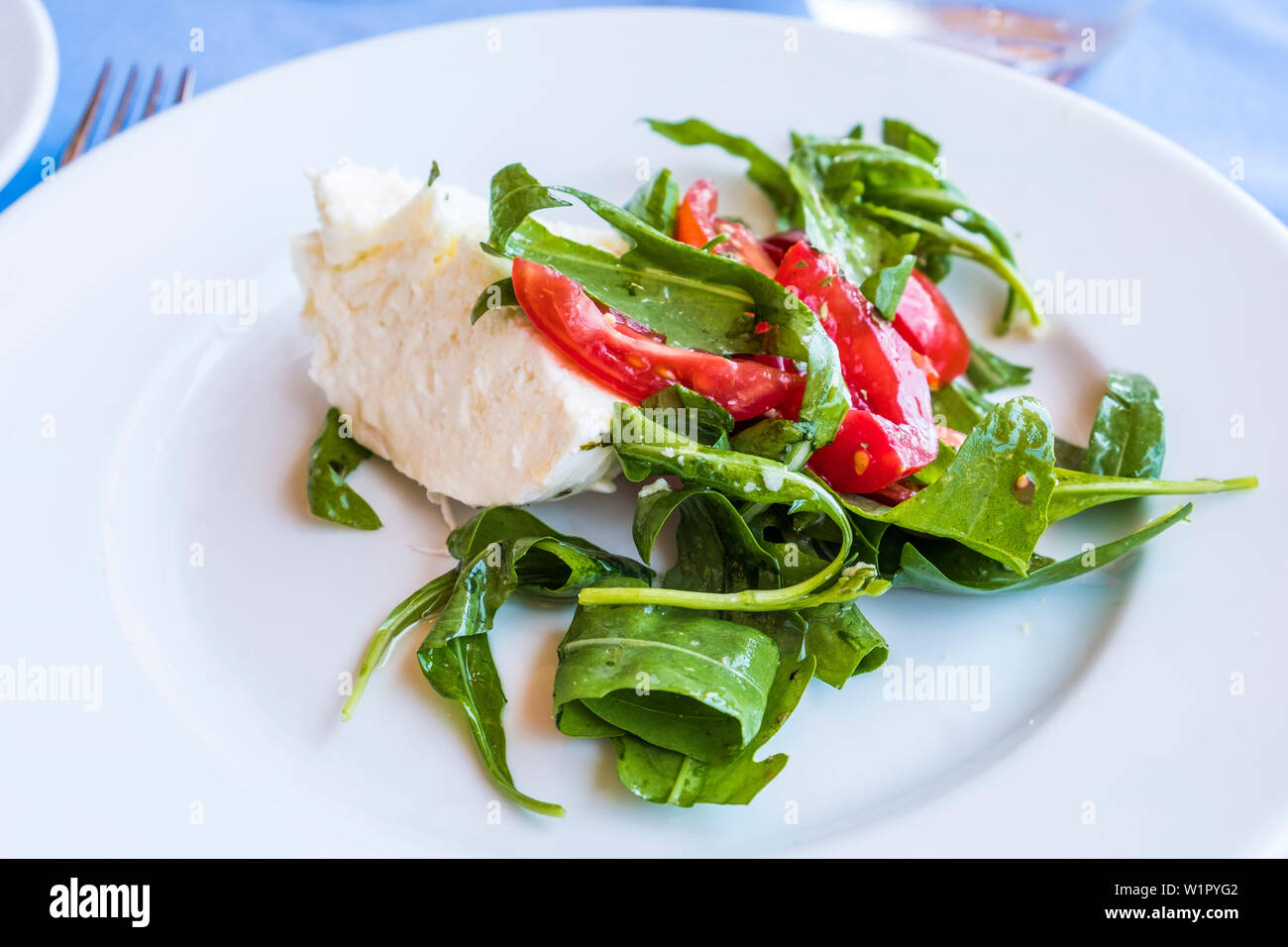 Typical Italian Caprese salad in the restaurant La Fontelina of Capri, island of Capri, Gulf of Naples, Italy Stock Photo