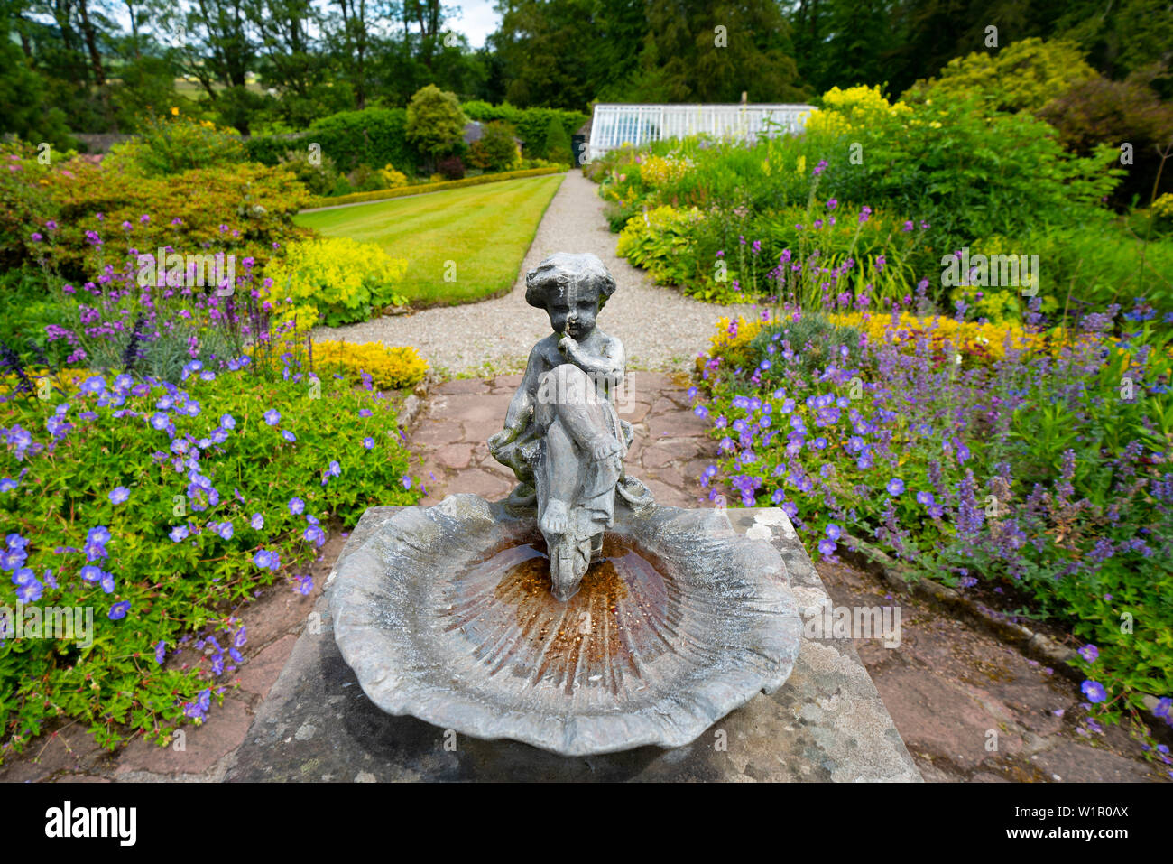 Detail of ornate birdbath in Walled Garden at NTS Geilston Garden in Cardross, Argyll and Bute, Scotland, UK Stock Photo