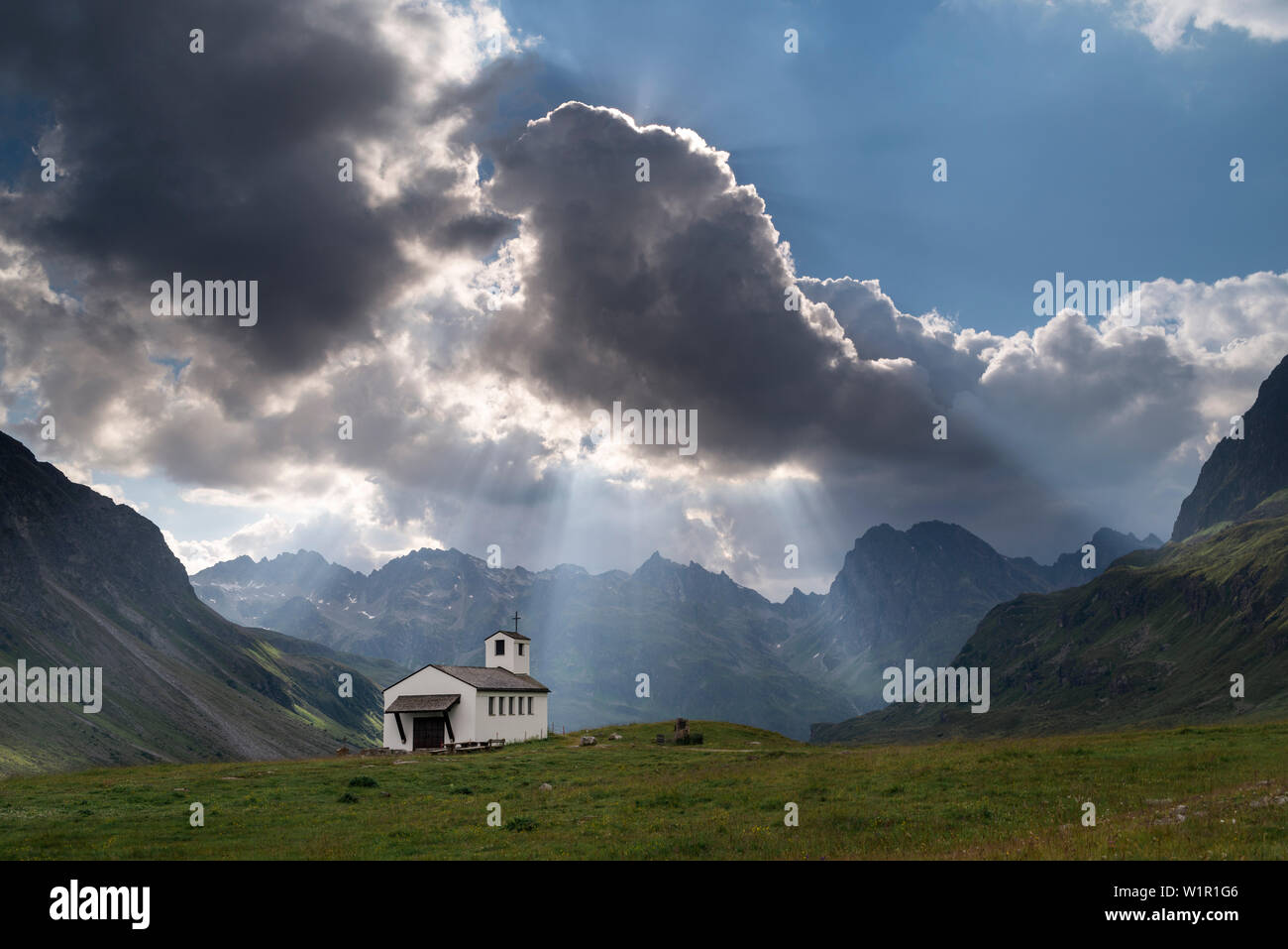 Chapel, cloud, sunbeam, mountain, Lake Silvrettasee, Bludenz, Vorarlberg, Austria, Europe Stock Photo