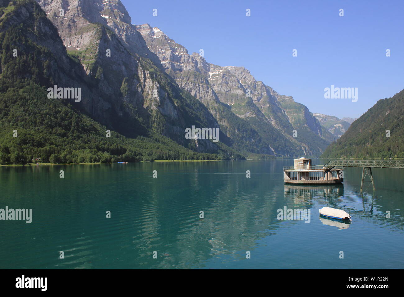Mountains of the Glaernisch range and clear water of Lake Kloental, Switzerland. Stock Photo