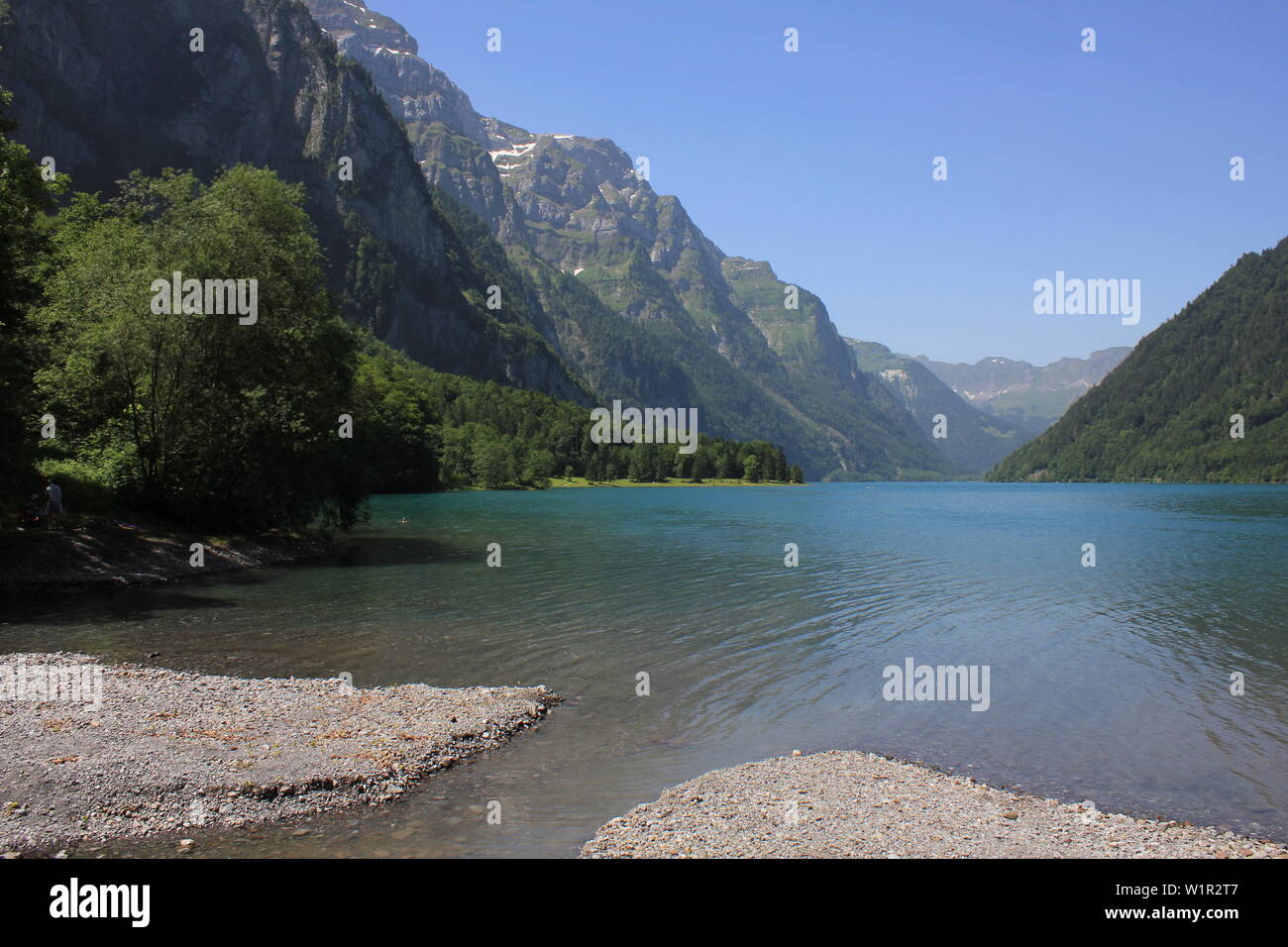 Clear turquoise water of Lake Kloental and surrounding mountains, Switzerland. Stock Photo