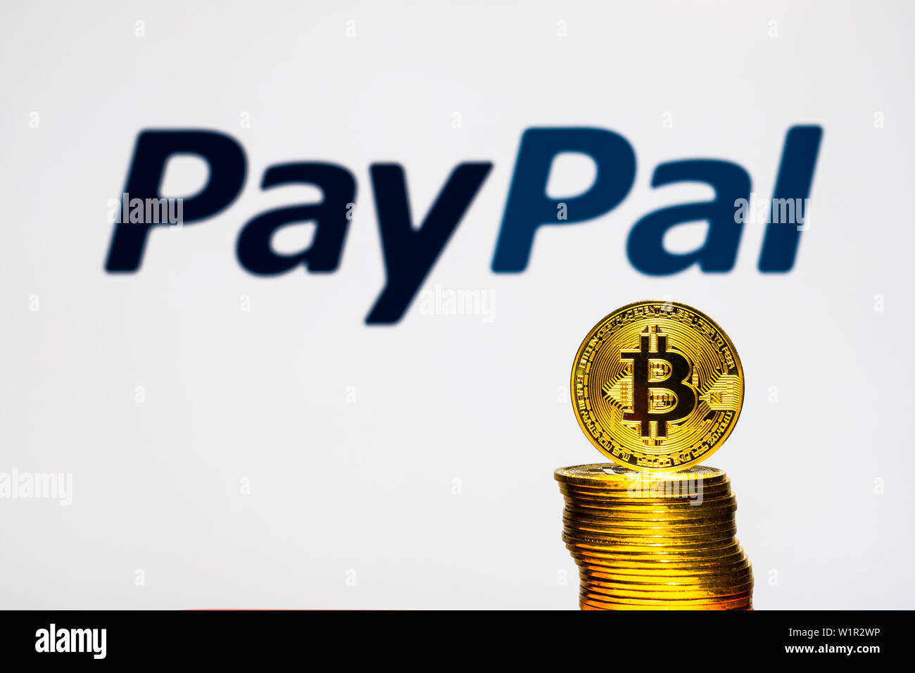 Gold Bitcoin coins with the PayPal logo on background screen. A new type of  business finance concept Stock Photo - Alamy