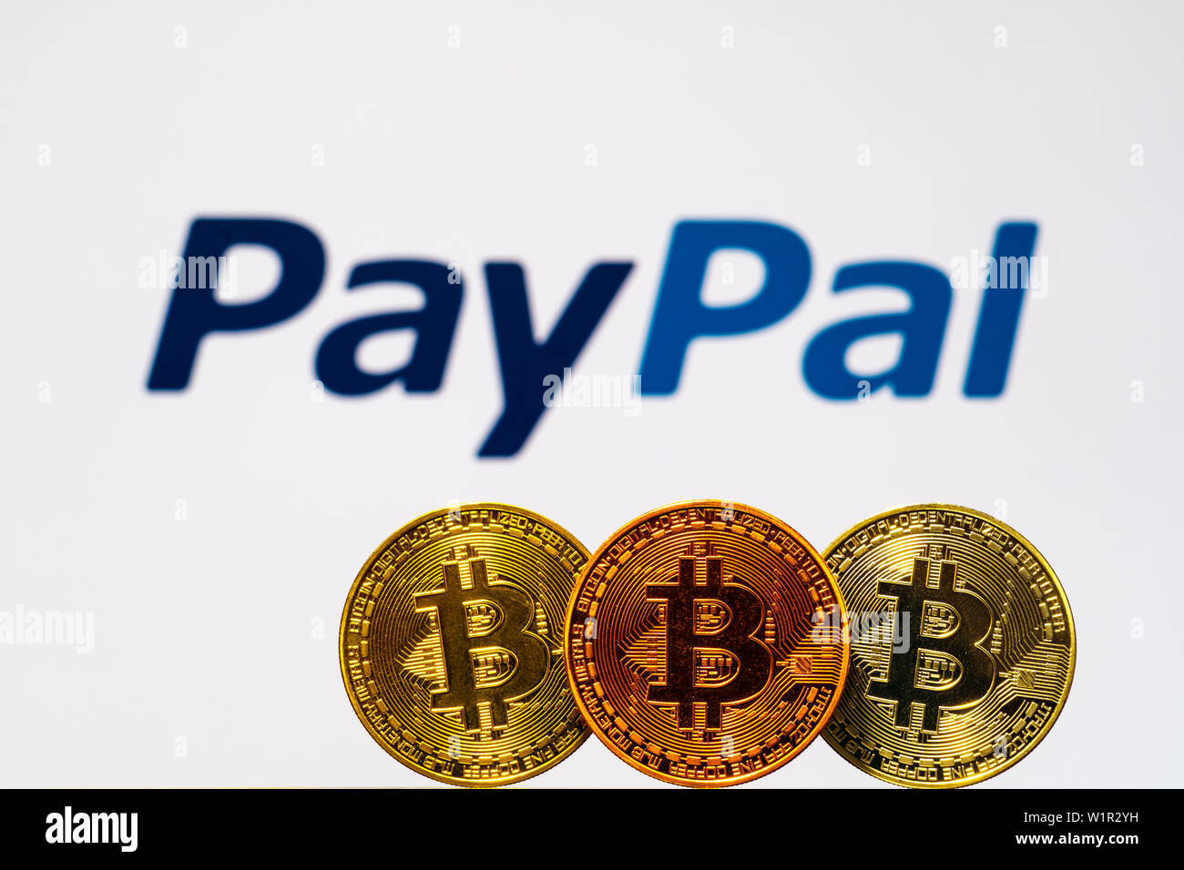 Gold Bitcoin coins with the PayPal logo on background screen. A new type of  business finance concept Stock Photo - Alamy