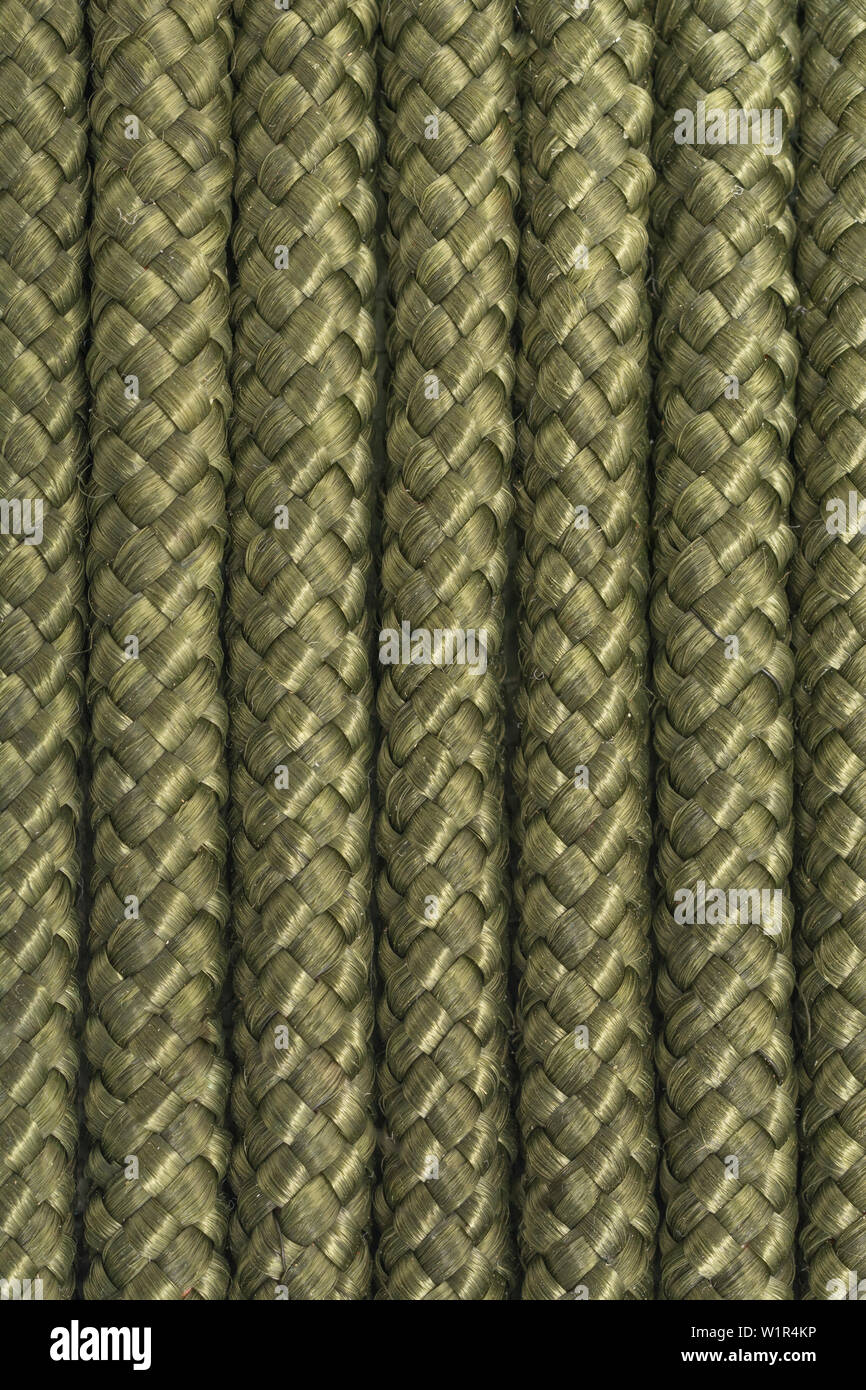 Macro close-up of braided green polypropylene rope. Diam. approx