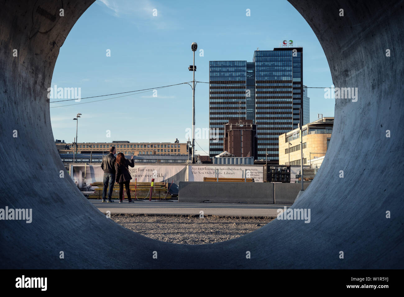 two persons look at construction sight at Opera House, Oslo, Norway, Scandinavia, Europe Stock Photo