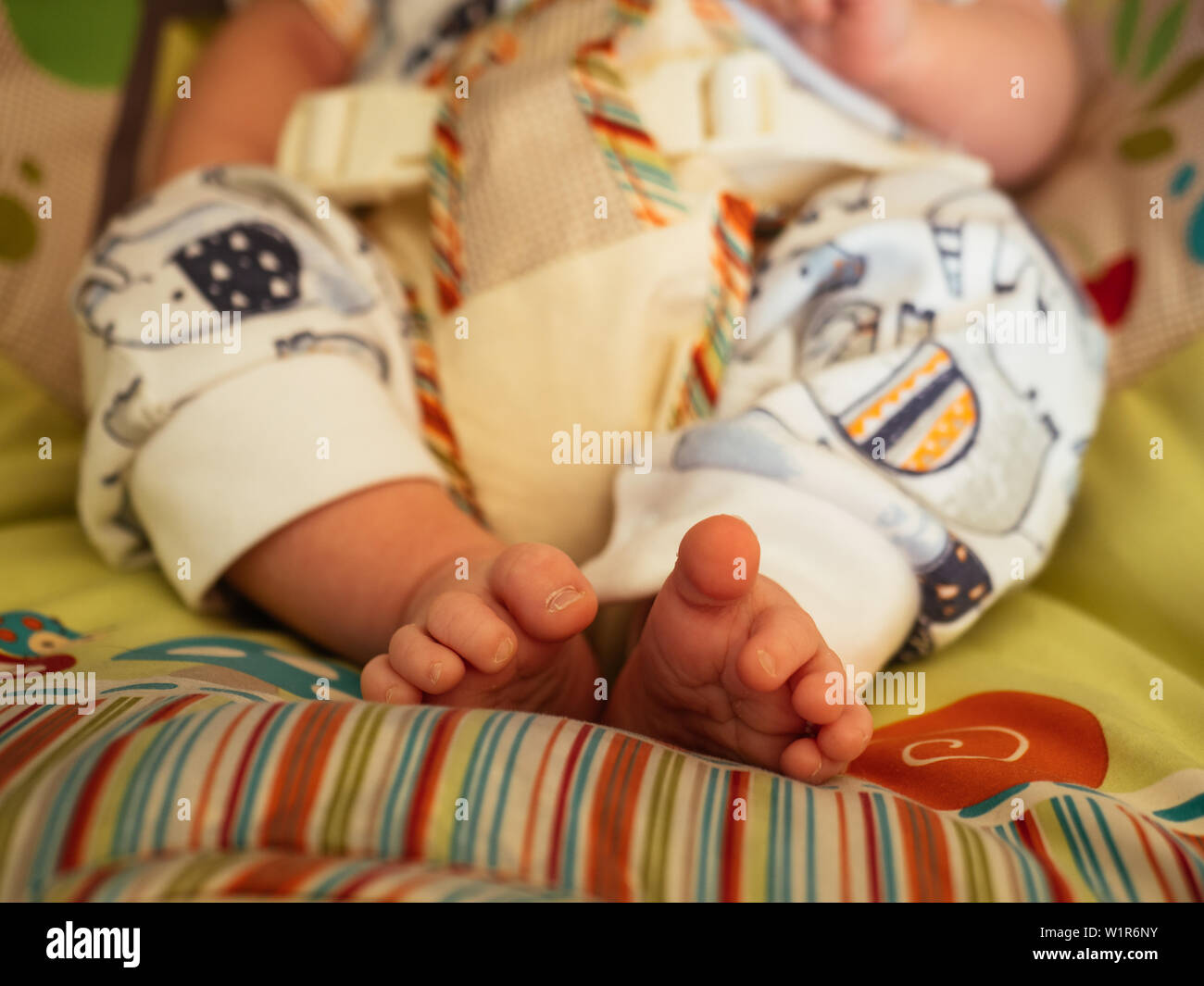 Baby in Toy Bouncer Stock Photo