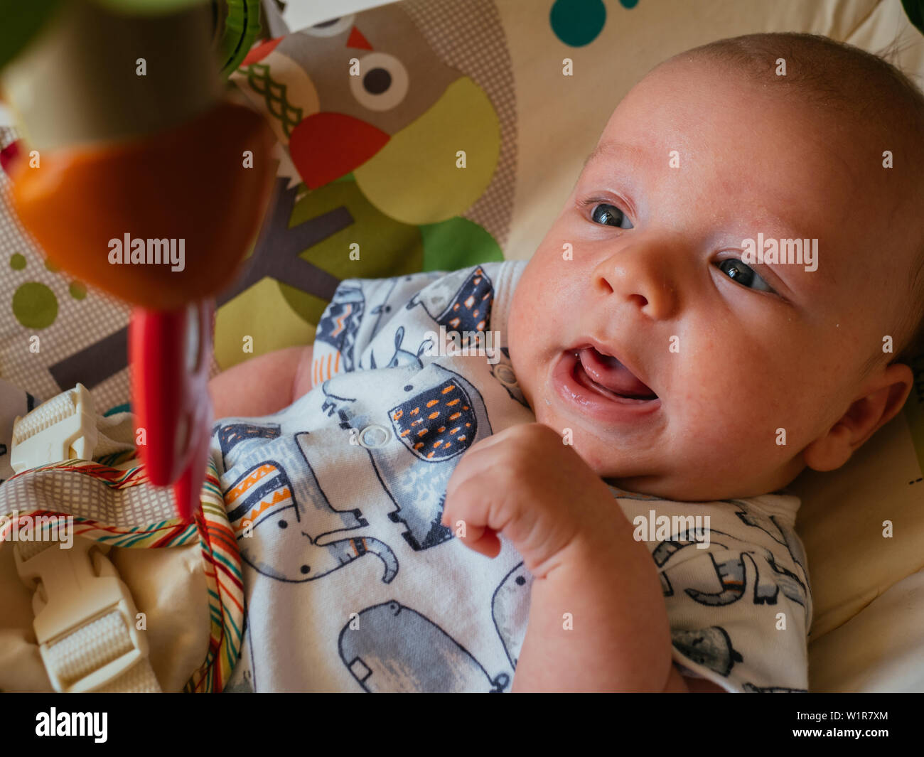 Baby in Toy Bouncer Stock Photo