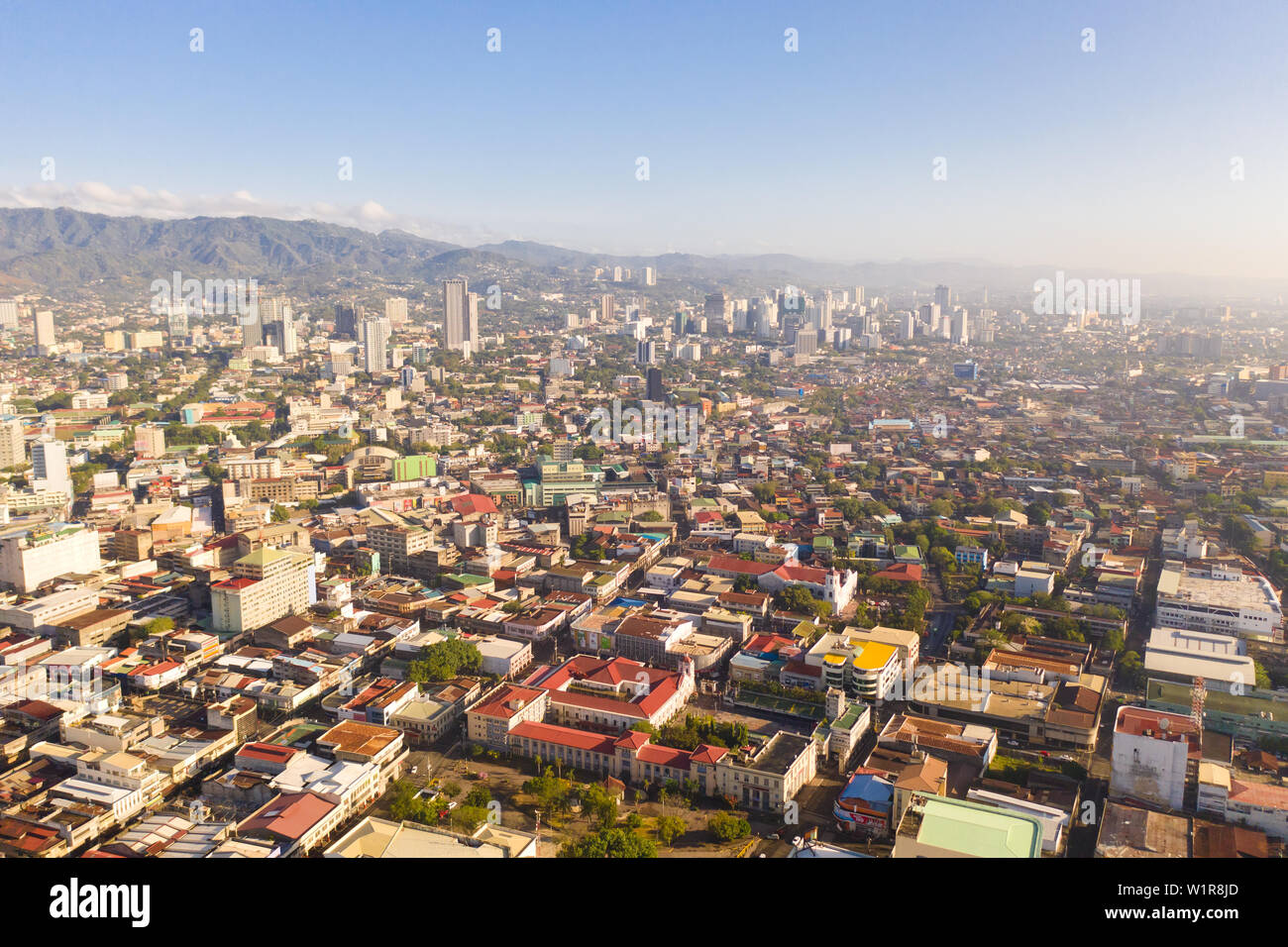 Cityscape in the morning. The streets and houses of the city of Cebu, Philippines, top view. Panorama of the city with houses and business centers. Stock Photo