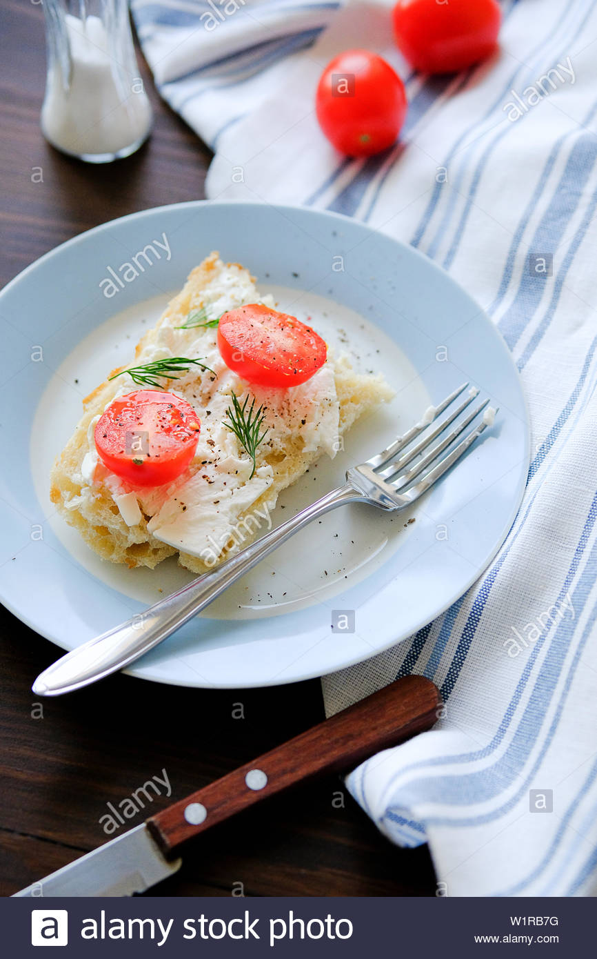 Slices Of Bread Sandwiches Tomatoes Cheese Greens Fork On A