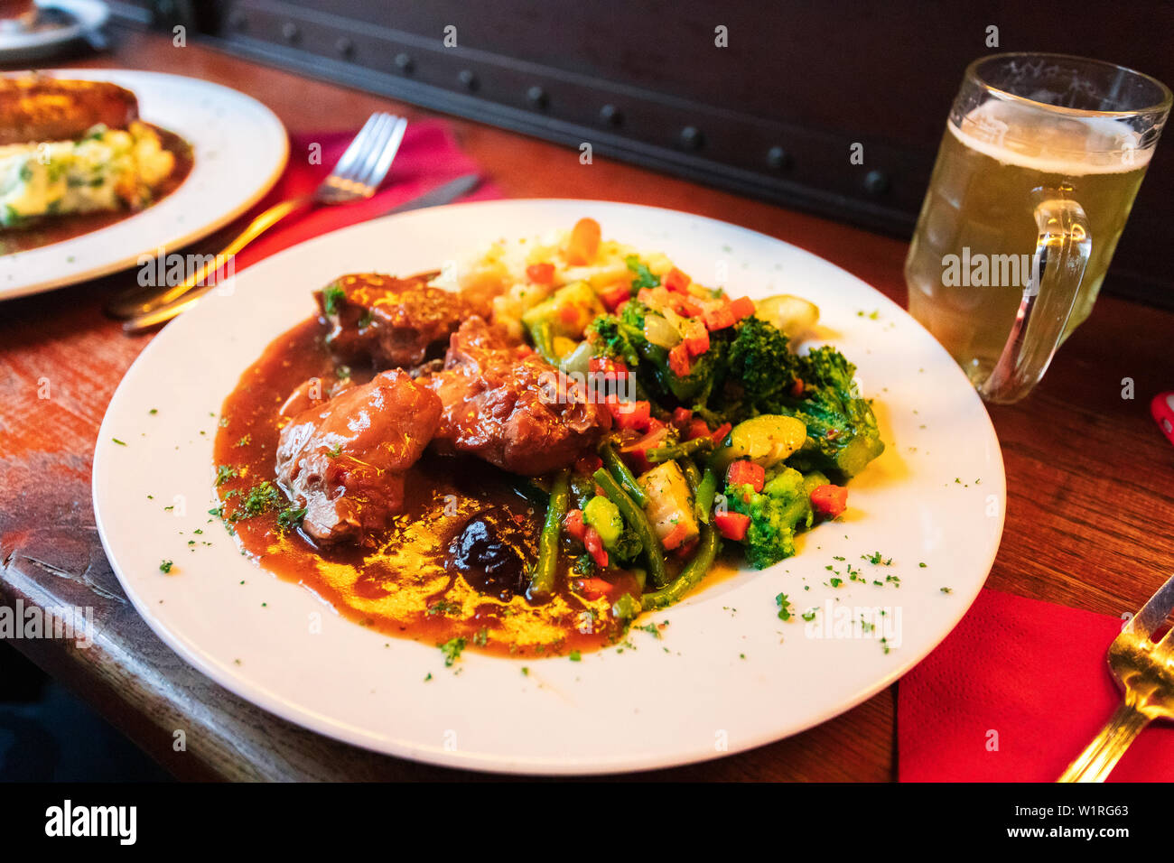 Braised Rabbit with Belgian Ale,Slow Cooked Belgian Beer Rabbit Stew , national cuisine, Traditional assorted Asia dishes, Top view. Stock Photo