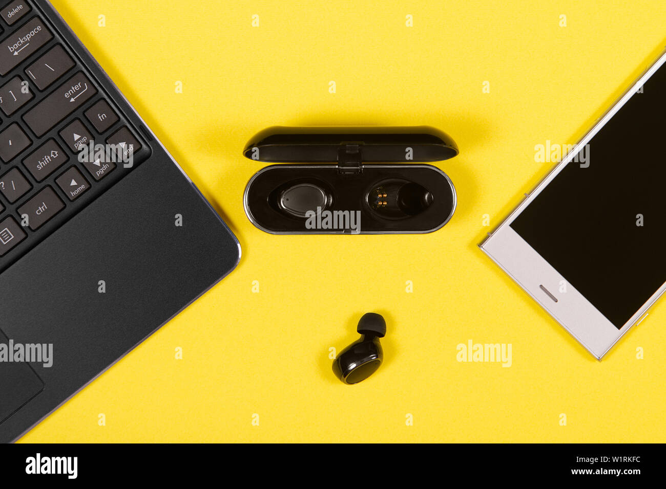 Flat lay composition with Electronics devices on yellow background Stock Photo