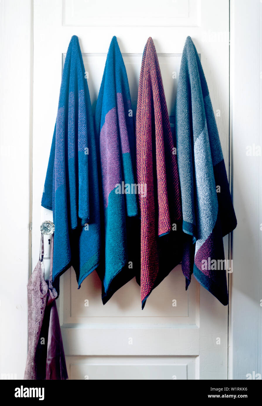 Bath towels hanging around Stock Photo Alamy