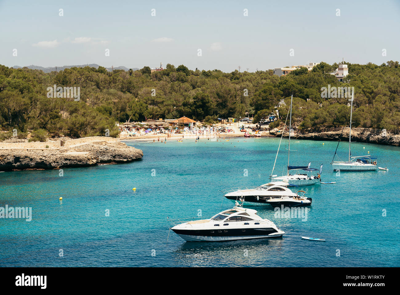 Yatchs in turquoise water in Cala Mondrago, Mondrago Natural Park, Majorca. Stock Photo