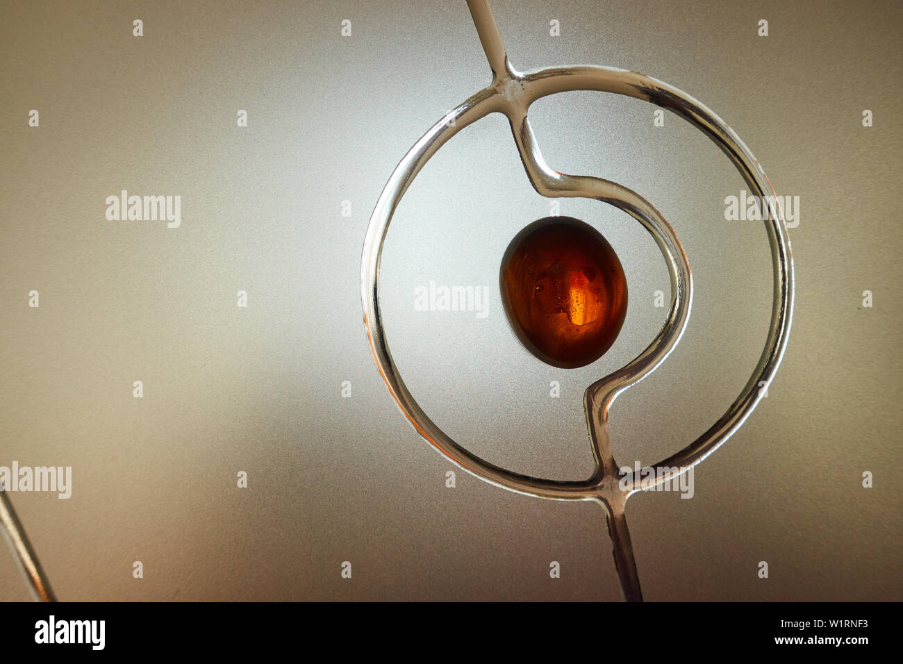 Frosted glass with decorative pattern, back light. Stock Photo