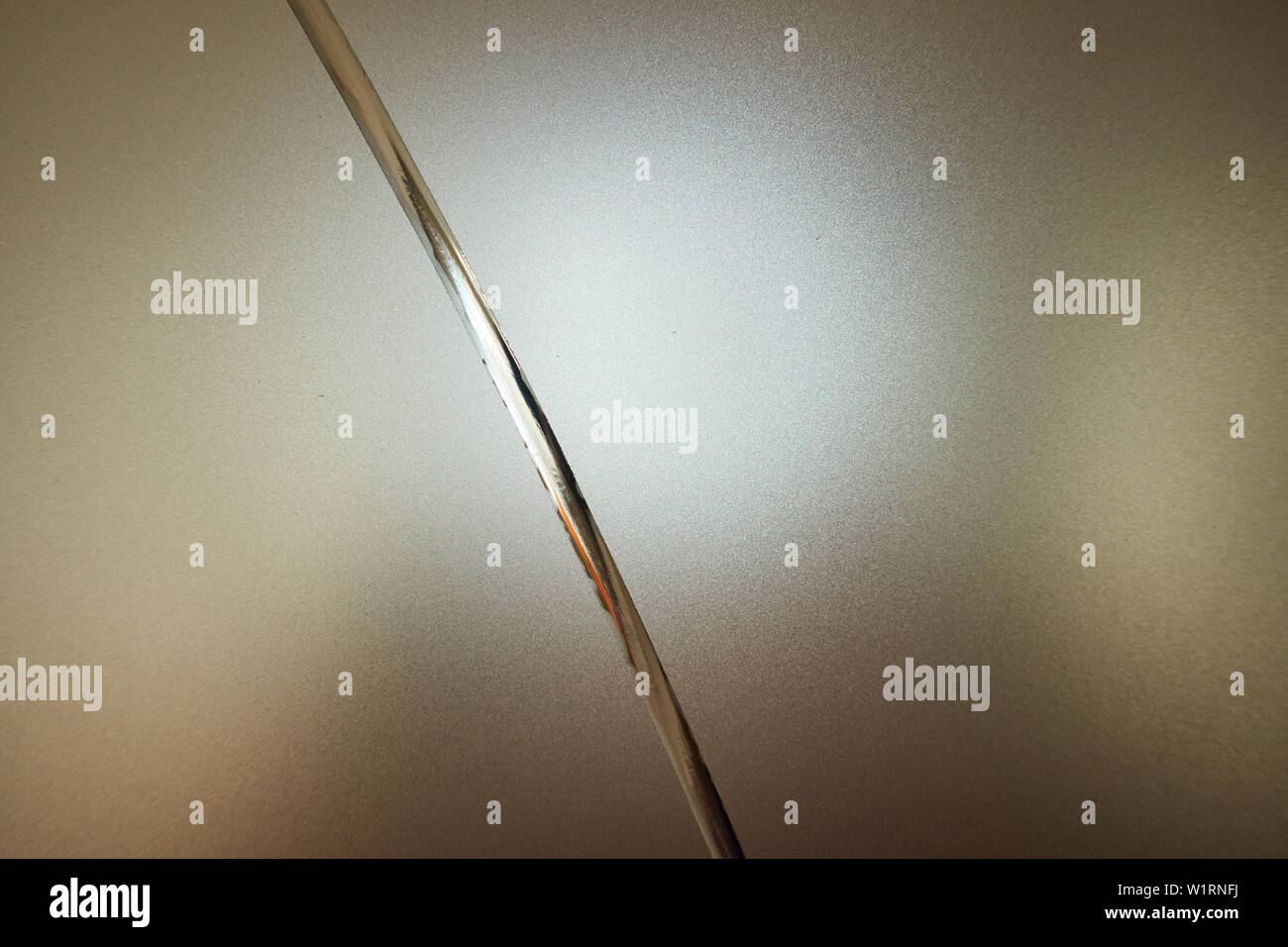 Frosted glass with decorative pattern, back light. Stock Photo