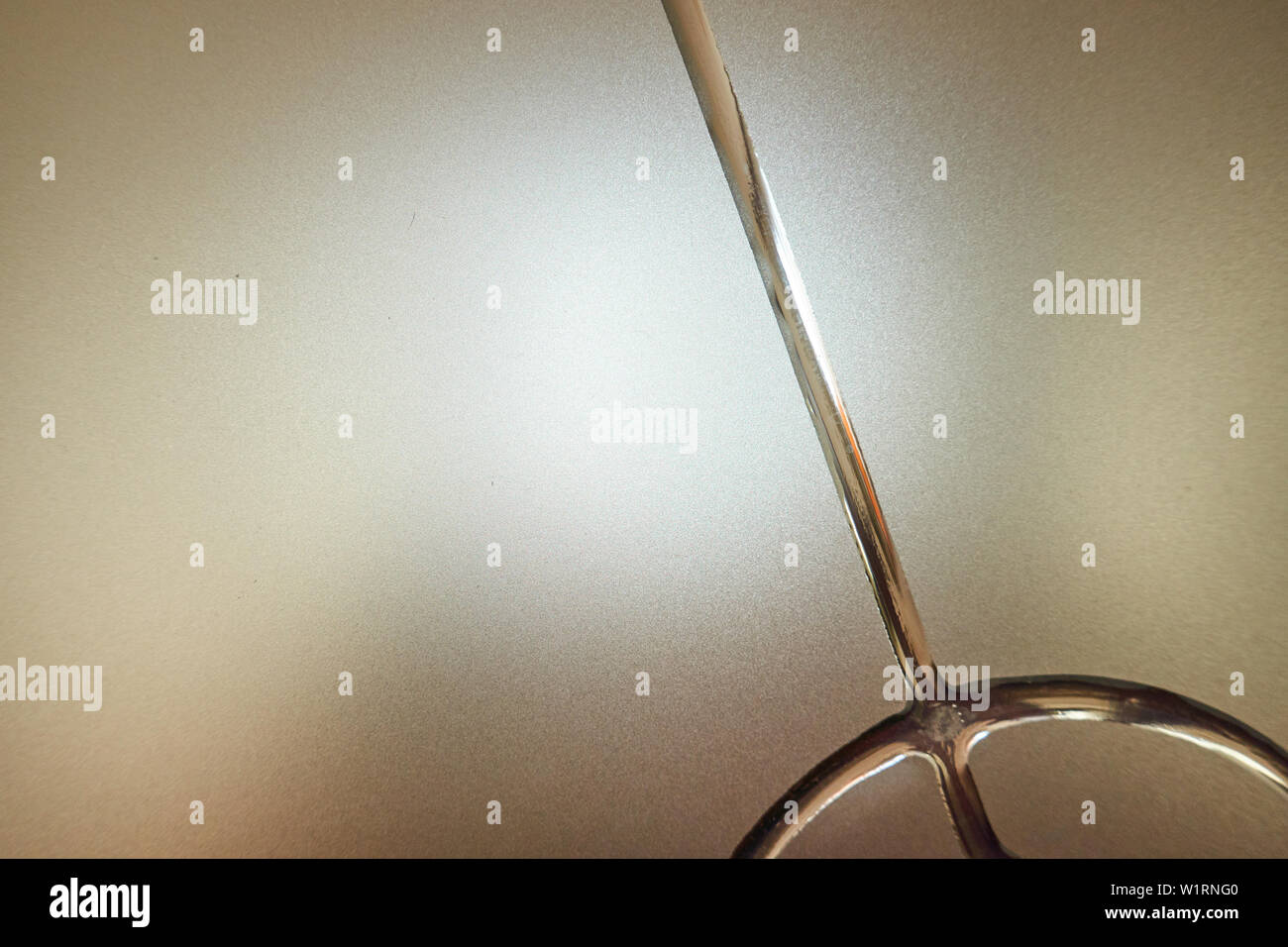Frosted glass with decorative pattern, back light. Stock Photo
