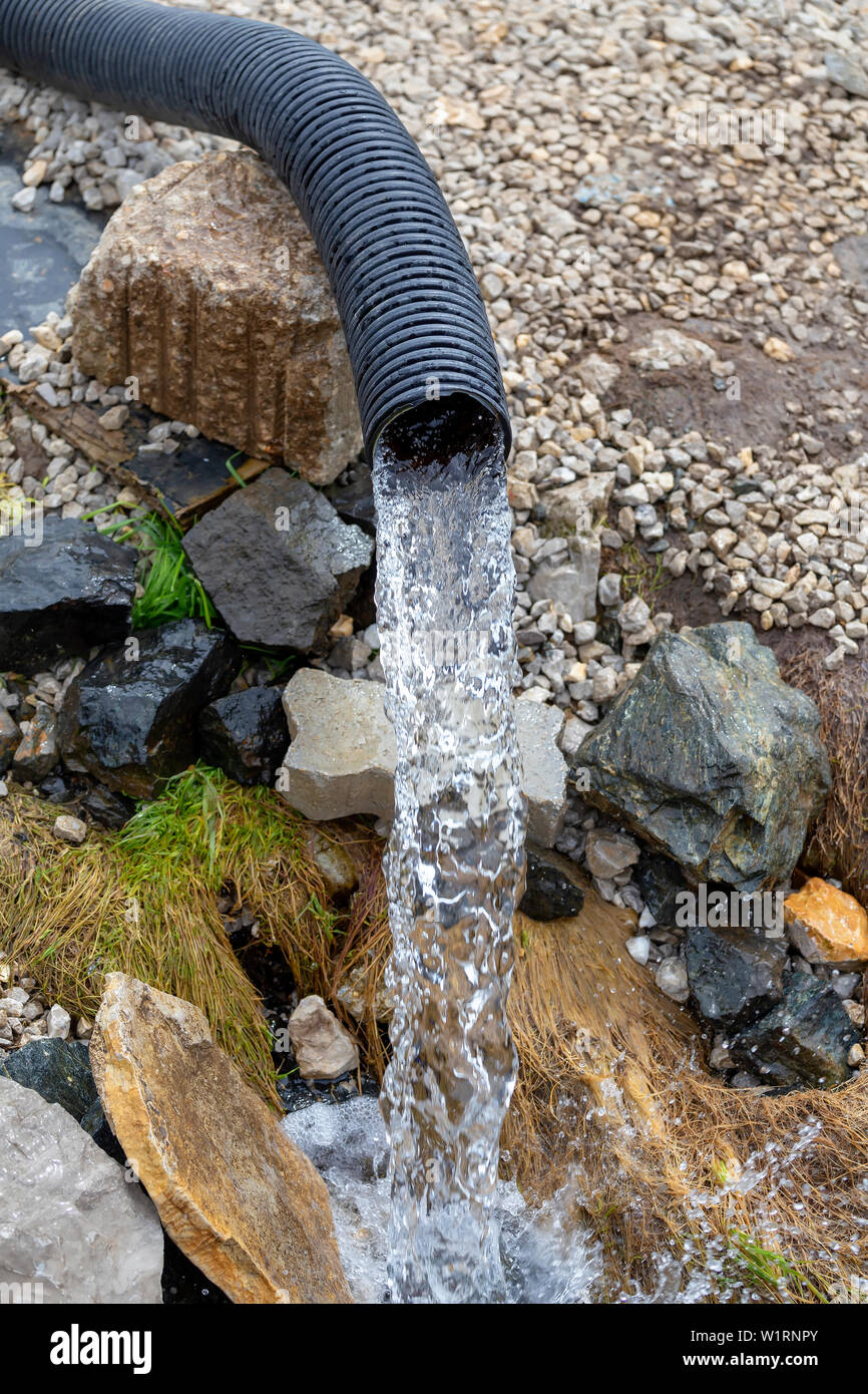 Stream of clean drink water from deep well without electricity. Cool