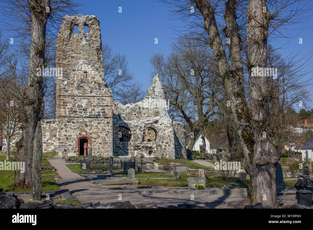 St Olaf Church ruins and surrounding graveyard in the ancient town of Sigtuna, Sweden Stock Photo