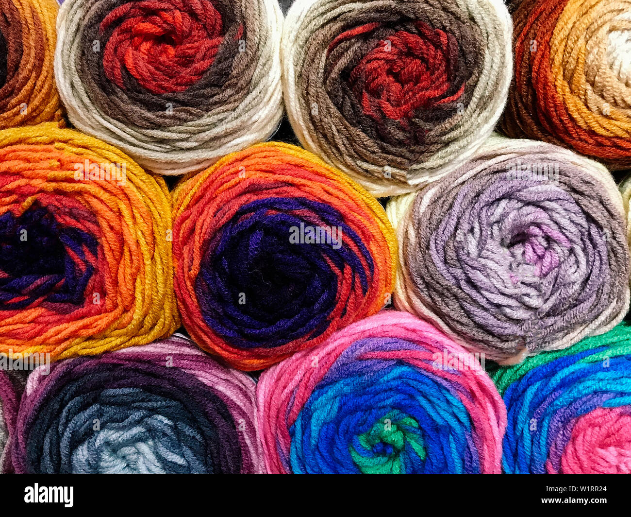 Texture of different colored balls of wool. Woolen threads of different ...