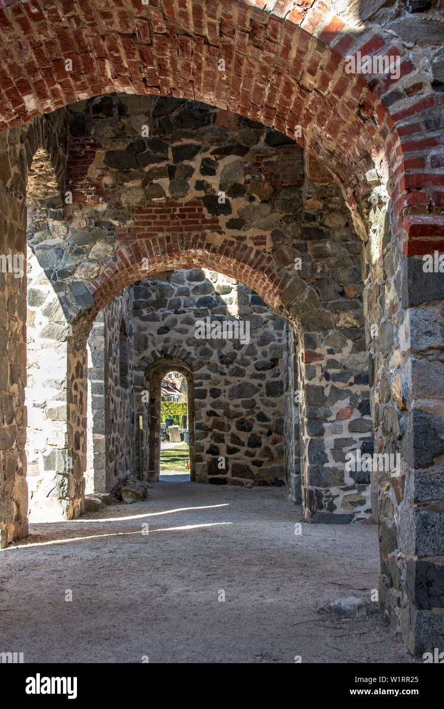 St Olaf Church ruins and surrounding graveyard in the ancient town of Sigtuna, Sweden Stock Photo