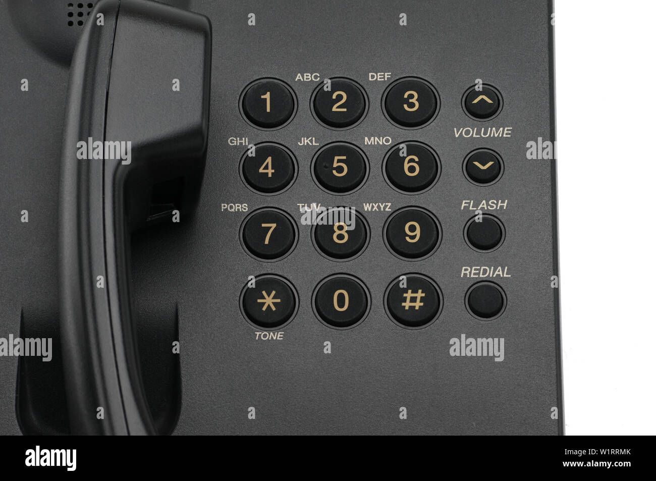 Classic wired telephone used at home and in offices on a white isolated