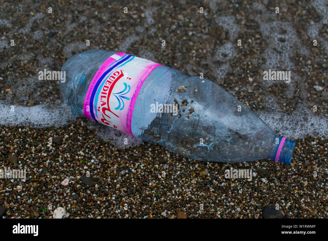 Plastic bottle washed ashore in the Mediterranean sea. Stock Photo