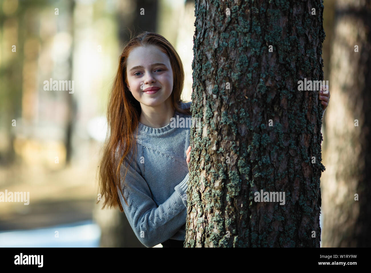 Cute teen girl posing in a summer Park Stock Photo - Alamy