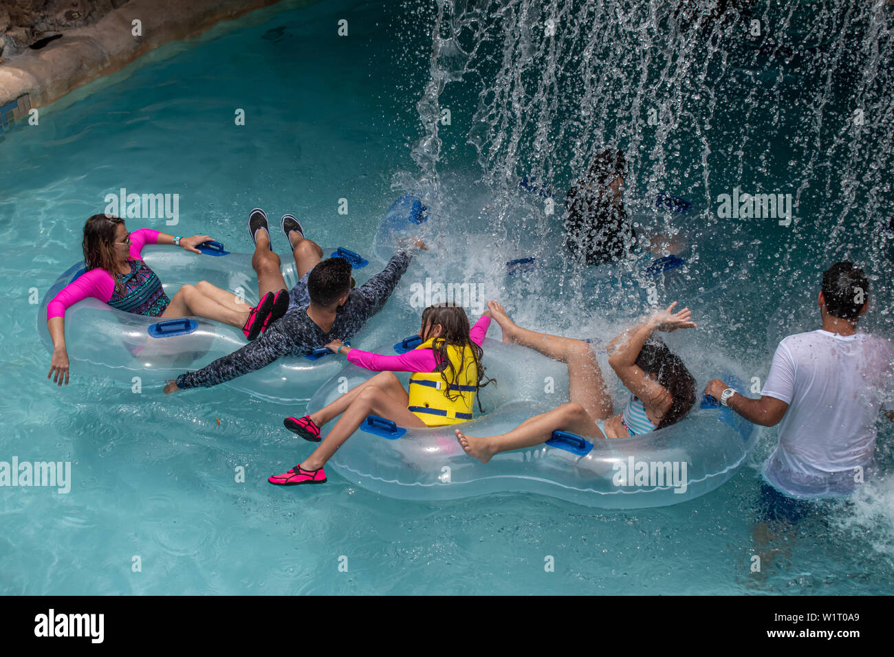 Orlando Florida July 01 19 Family Enjoying Water Fall In Lazy River At Aquatica Stock Photo Alamy