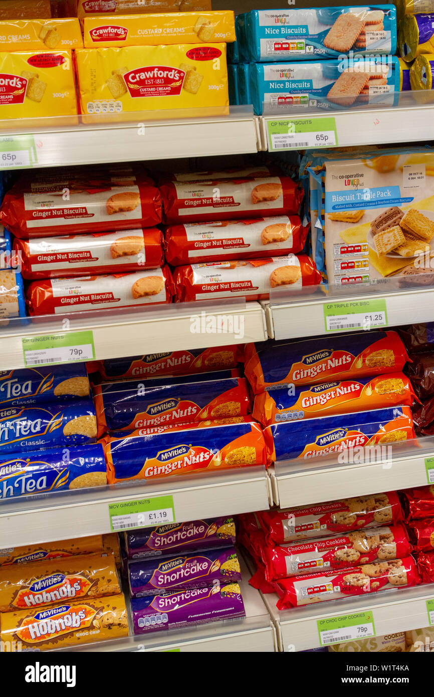Packets of biscuits on a Co-op supermarket's shelves Stock Photo