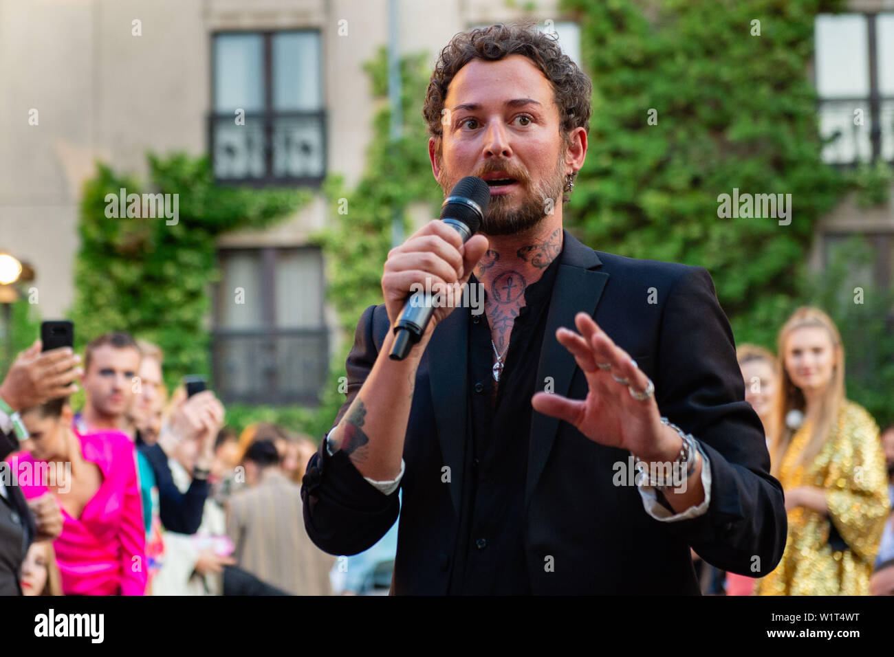Berlin, Germany. 03rd July, 2019. Designer Marcel Ostertag thanks the audience after his show. The collections for Spring/Summer 2020 will be presented at Berlin Fashion Week. Credit: Lisa Ducret/dpa/Alamy Live News Stock Photo