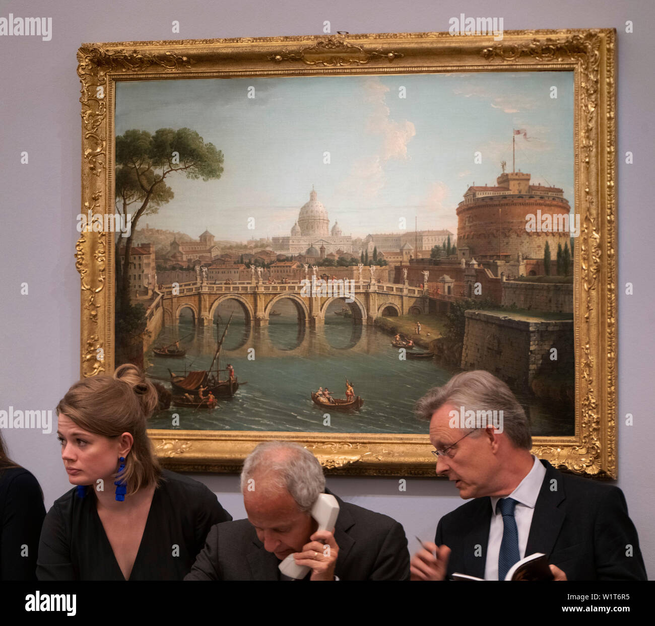 Sotheby’s, London, UK. 3rd July 2019. The summer Old Masters Evening sale offers paintings from the 14th - 19th century by many of the most important painters of Western art. Highlights include a masterpiece by each of Britain’s greatest landscape painters - Turner, Constable and Gainsborough - and extraordinary works from the Baroque by Ribera and the exceptionally rare Johann Liss. Image: Antonio Joli, Rome, looking towards the Castel Sant’ Angelo, with Saint Peters Basilica beyond, sells for £543,000. Credit: Malcolm Park/Alamy Live News. Stock Photo