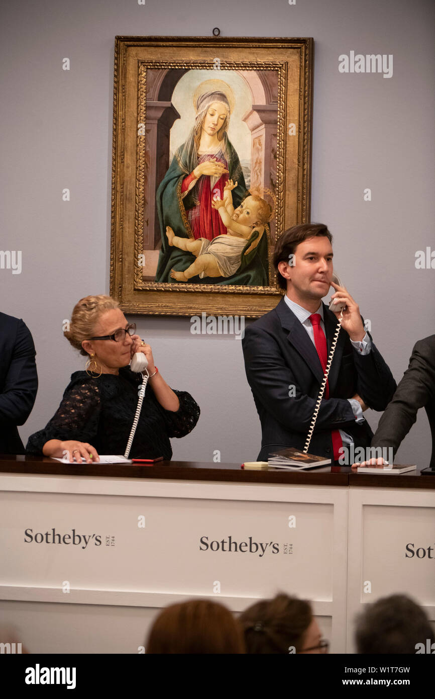 Sotheby’s, London, UK. 3rd July 2019. The summer Old Masters Evening sale offers paintings from the 14th - 19th century by many of the most important painters of Western art. Highlights include a masterpiece by each of Britain’s greatest landscape painters - Turner, Constable and Gainsborough - and extraordinary works from the Baroque by Ribera and the exceptionally rare Johann Liss. Image: Alessandro di Mariano Filipepi, called Sandro Boticelli and Studio, Madonna and Child, sells for £3,015,000. Credit: Malcolm Park/Alamy Live News. Stock Photo