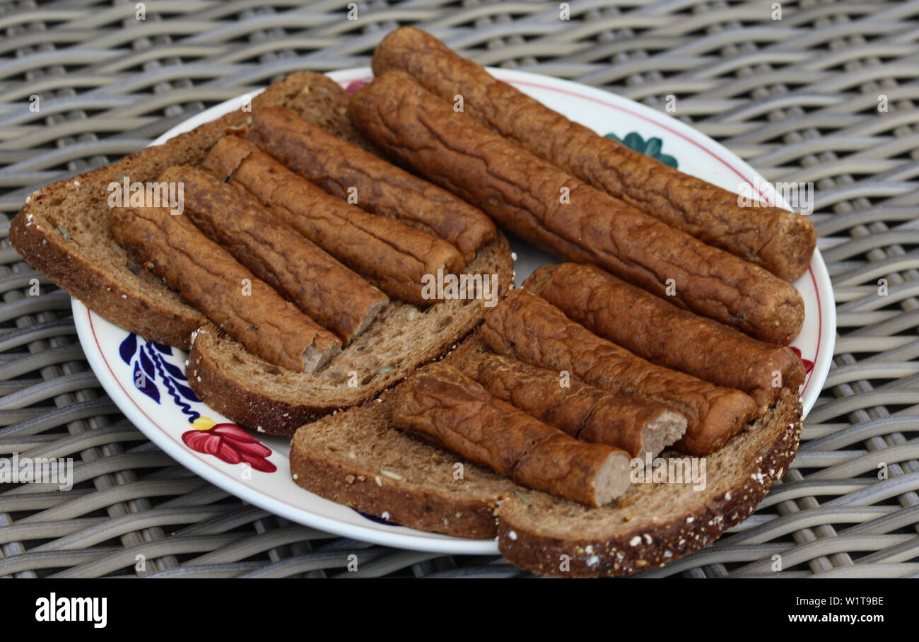 close up of frikandel on a slice of bread, a traditional Dutch snack, a sort of minced meat hot dog Stock Photo