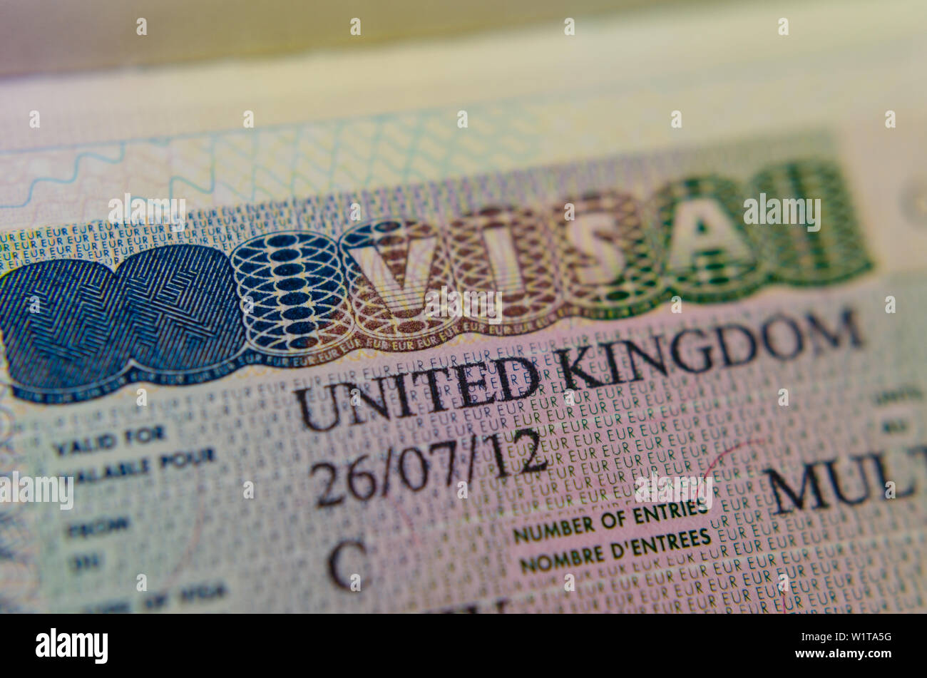 UK Multiple Entry Visa (Type C) sticker in the passport. Macro photo. Stock Photo