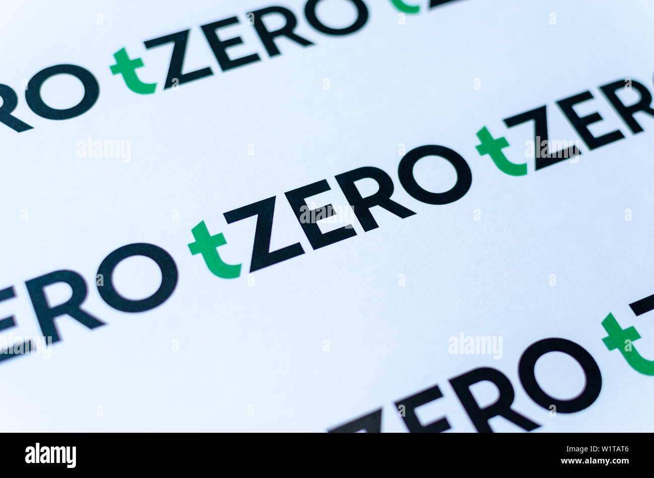 tZero logos on the brochure. Macro photo. Stock Photo