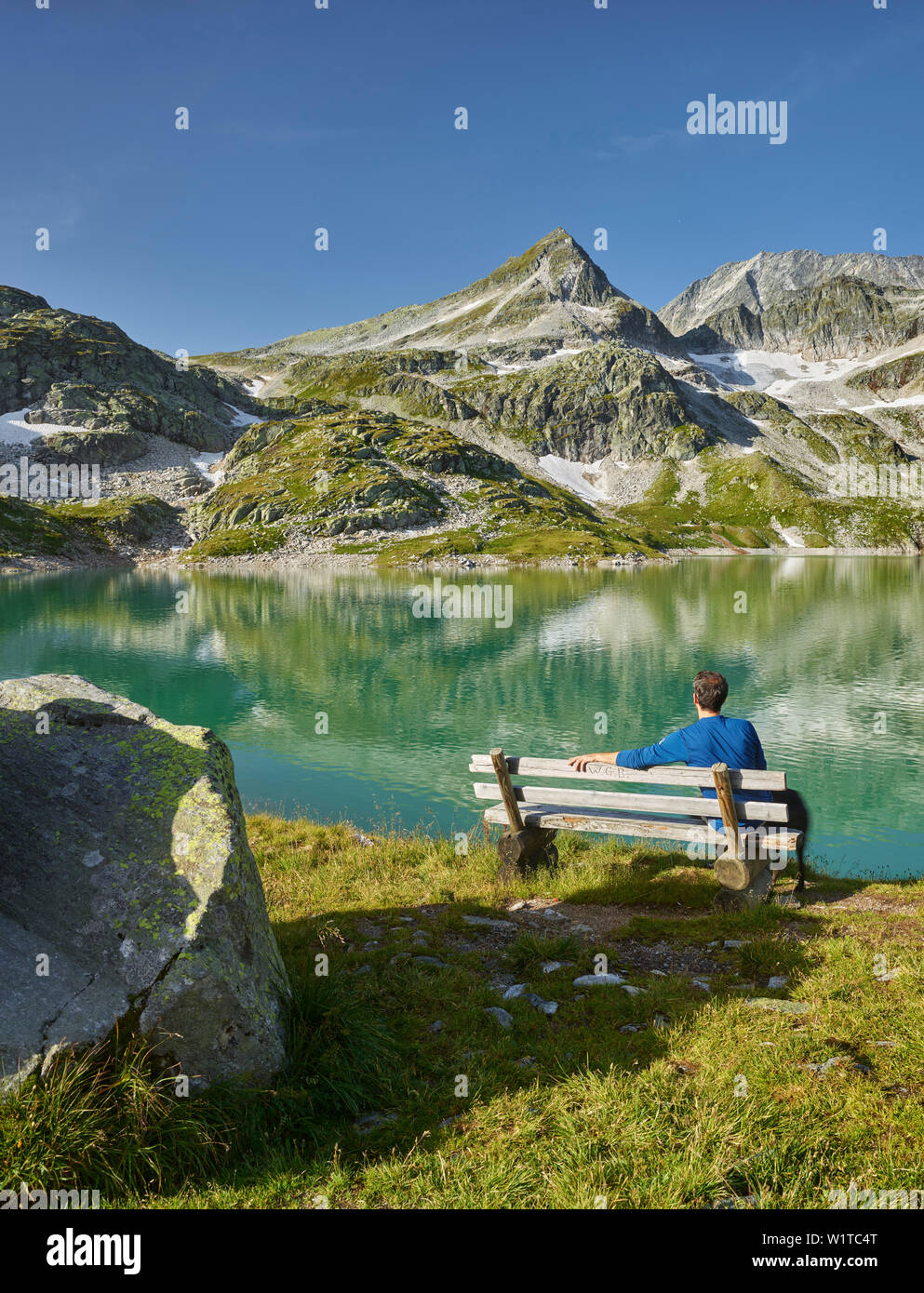 hikers on the resting place at the weißsee, Tauern Kogel, Hohe Tauern National Park Stock Photo