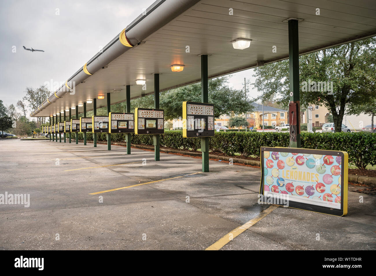 damaged display and airplance in the sky, sequence of drive in displays at fastfood restaurant, Houston, Texas, US, United States of America, North Am Stock Photo