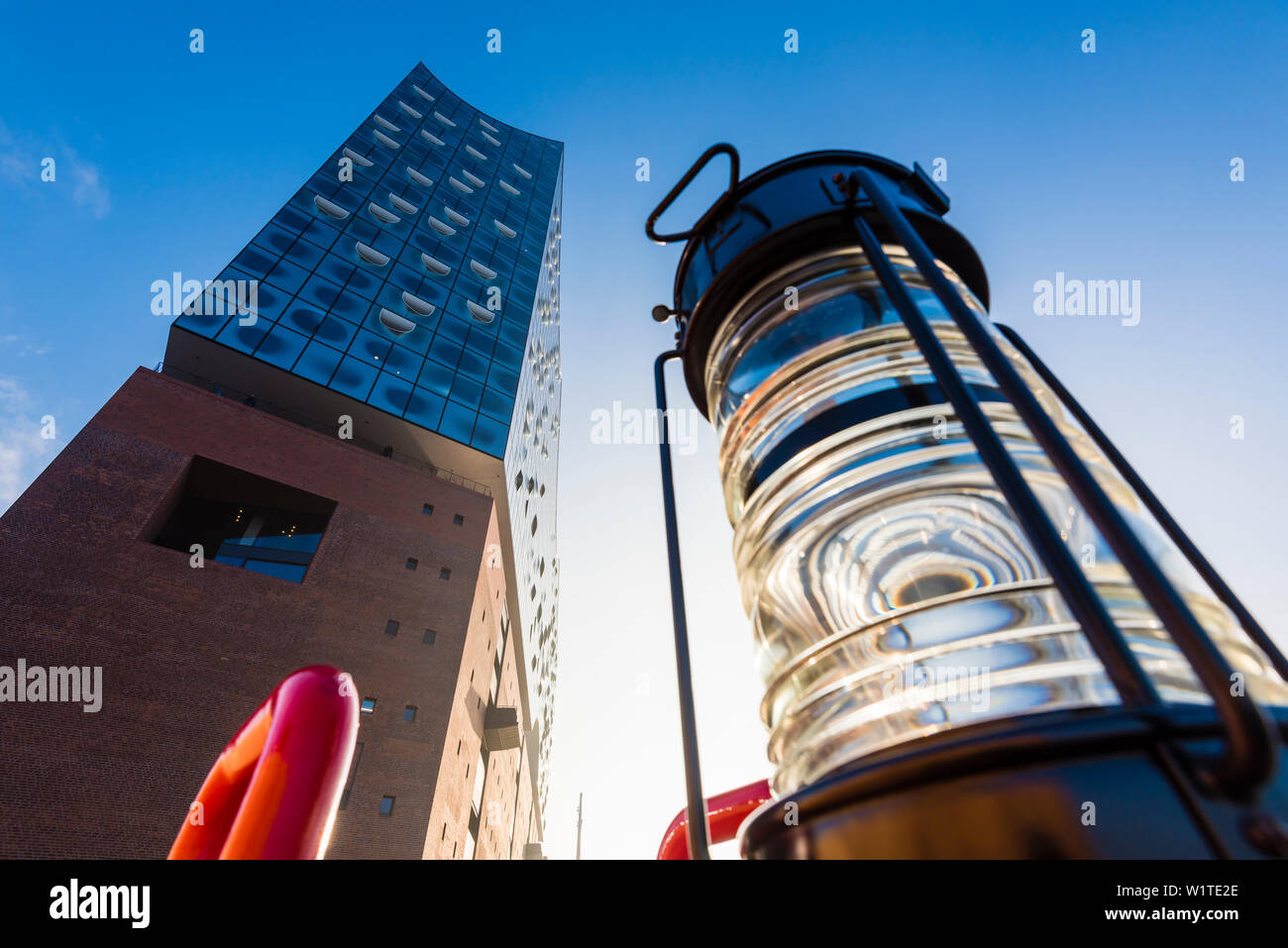 A navigation light in front of the Elbphilharmonie from a low-angle view, Hamburg, Germany Stock Photo