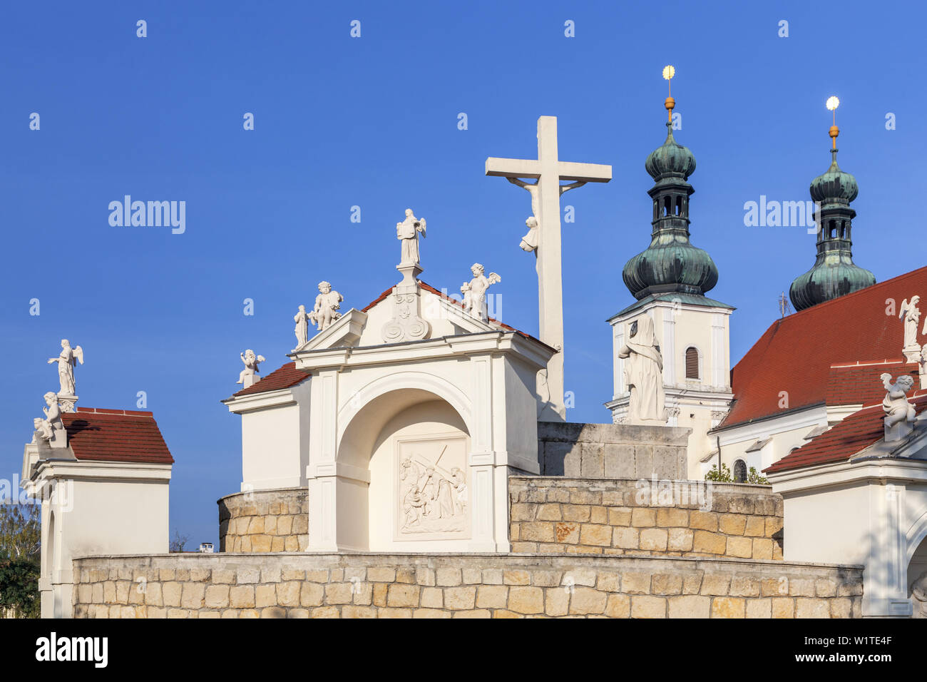 Calvary in front of pilgrimage basilica Unserer Lieben Frau in Frauenkirchen, Burgenland, Eastern Austria, Austria, Europe Stock Photo