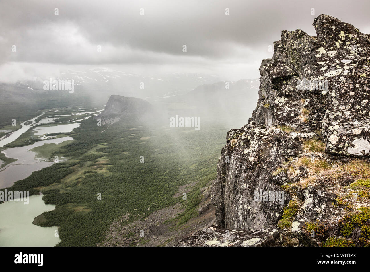 Rain and clouds over Sarek national park. View from Skierffe mountain on to Rapadalen/Laidaure Delta, Sarek national park, Laponia, Lappland, Sweden. Stock Photo