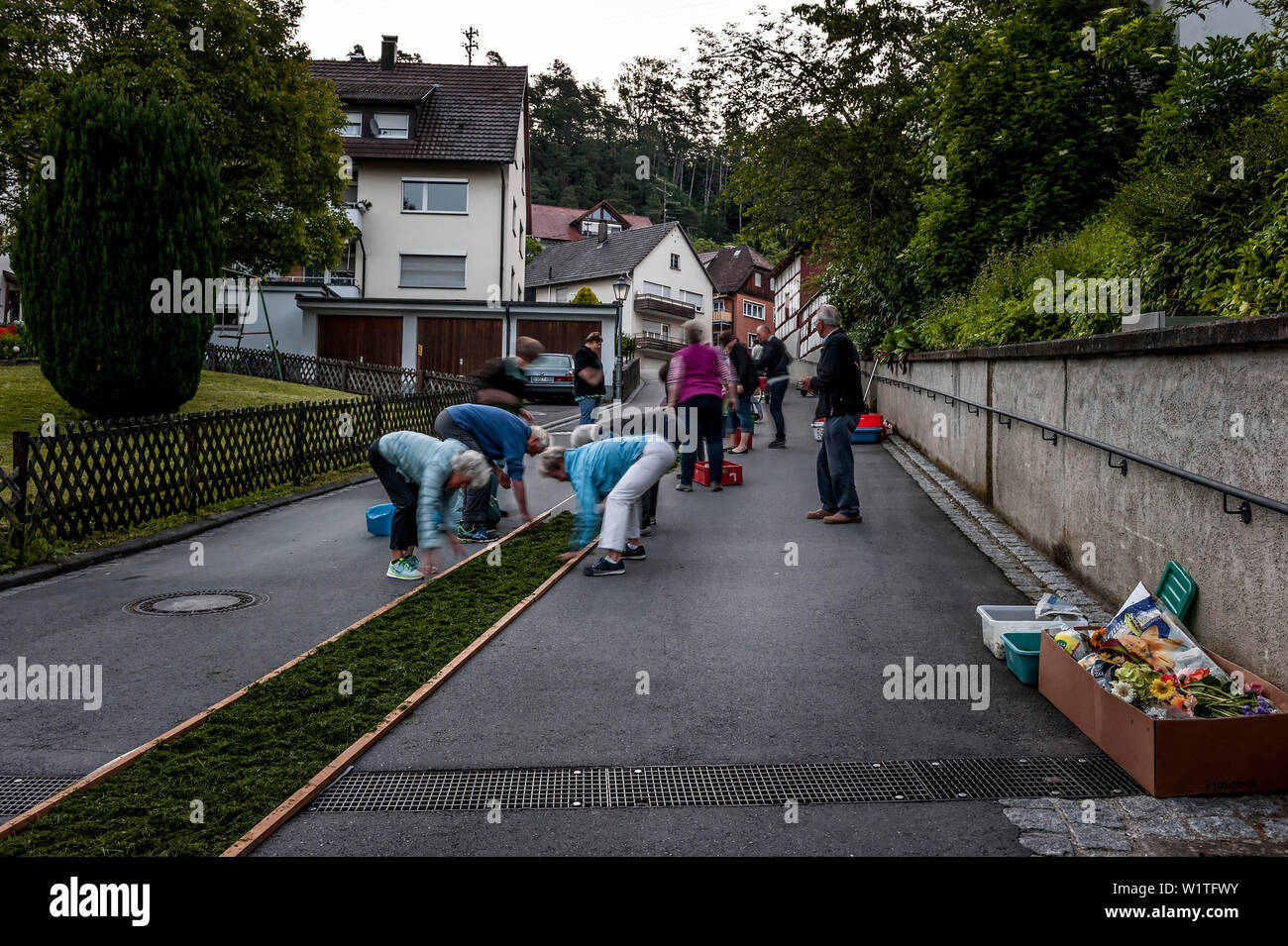People arranging petals for the flower carpet, Corpus Christi, Feast of