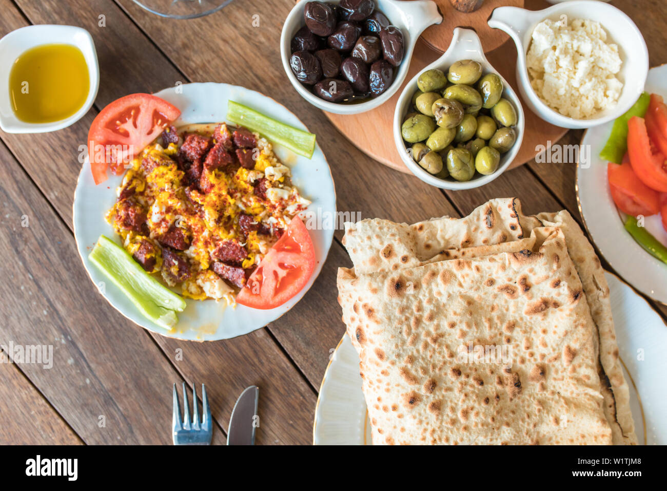 Traditional Turkish Breakfast Table. Turkish Breakfast Food Cuisine Culture. Turkish pide yufka ekmek, tea, bagel, borek, sikma, cheese, olives. Stock Photo