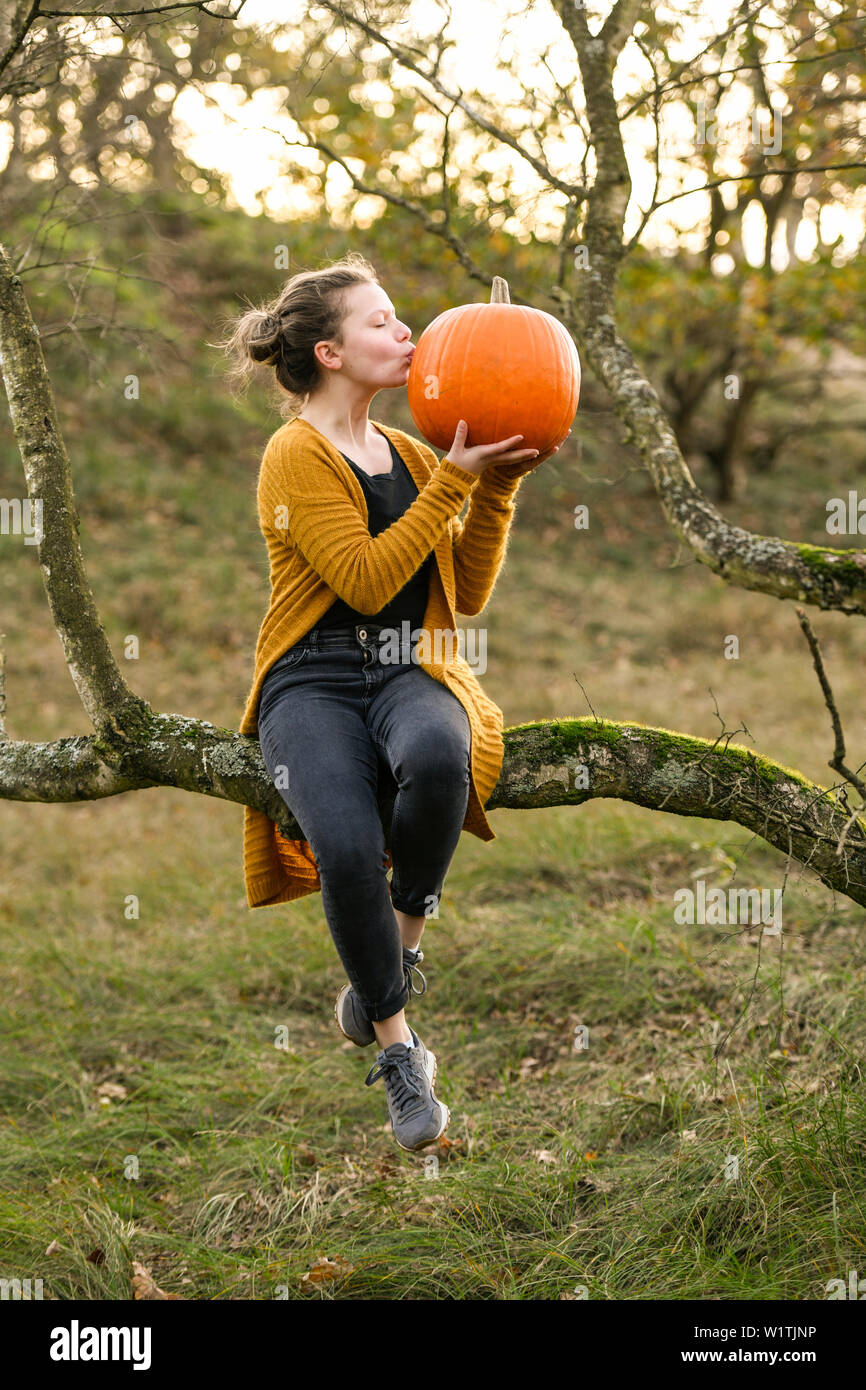 Girl with pumpkin on Halloween, Hamburg, Germany Stock Photo