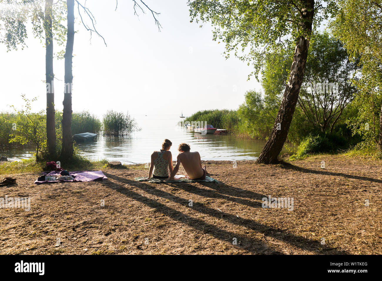 Swimming in the lake Müritz, beach, boats, sailing boats, windsurfing