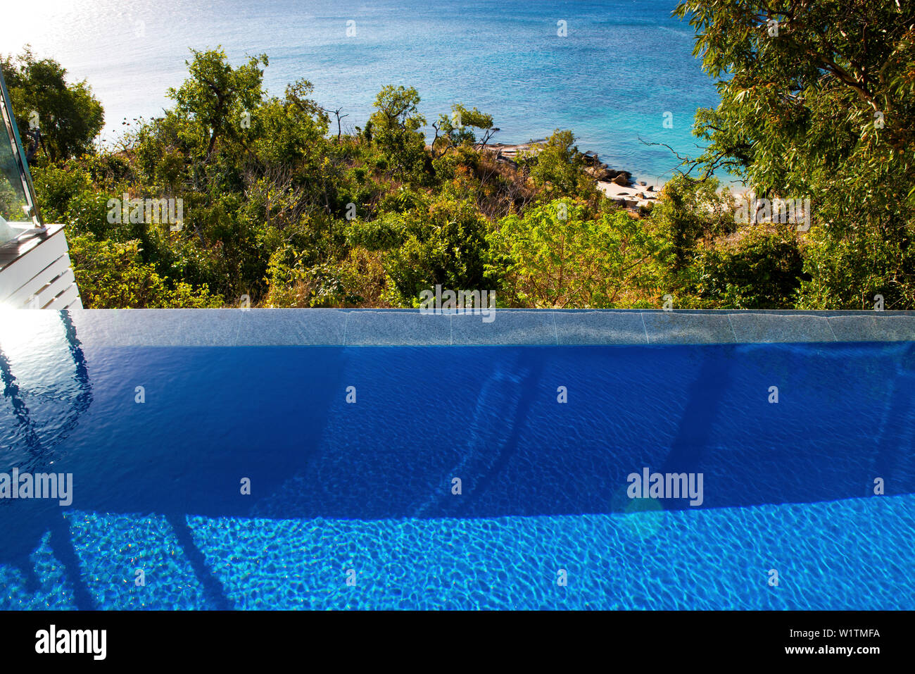 The pool of the Villa at the Lizard Island Resort is high above the ocean Stock Photo