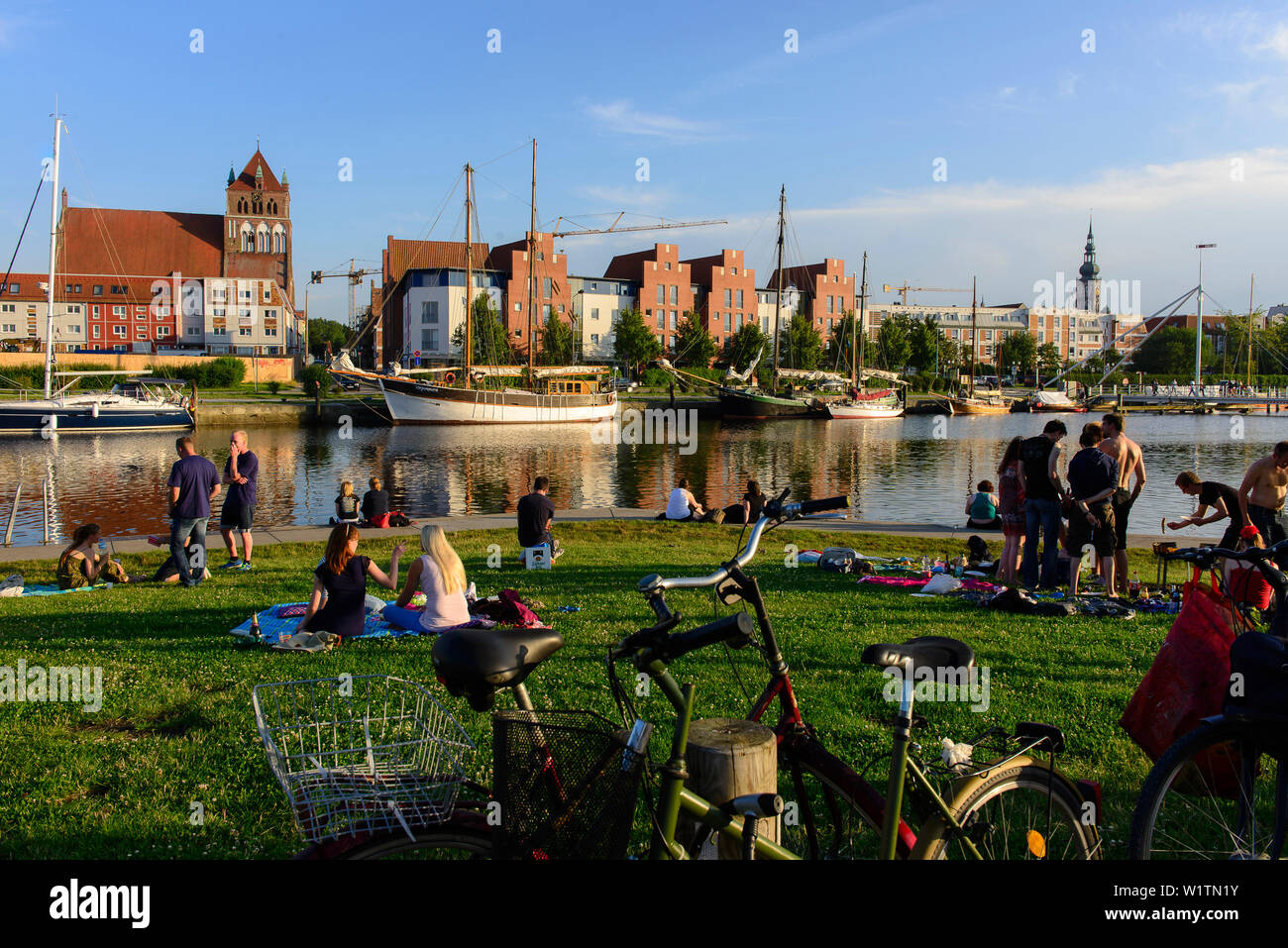 Picnic and barbecü on meadow at Greifswald harbor, Ostseeküste, Mecklenburg-Western Pomerania, Germany Stock Photo