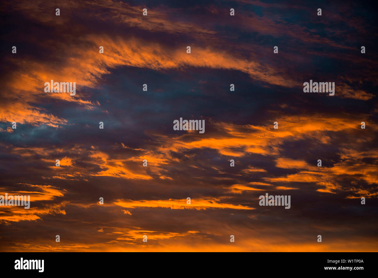 Sunset with red illuminated clouds Stock Photo