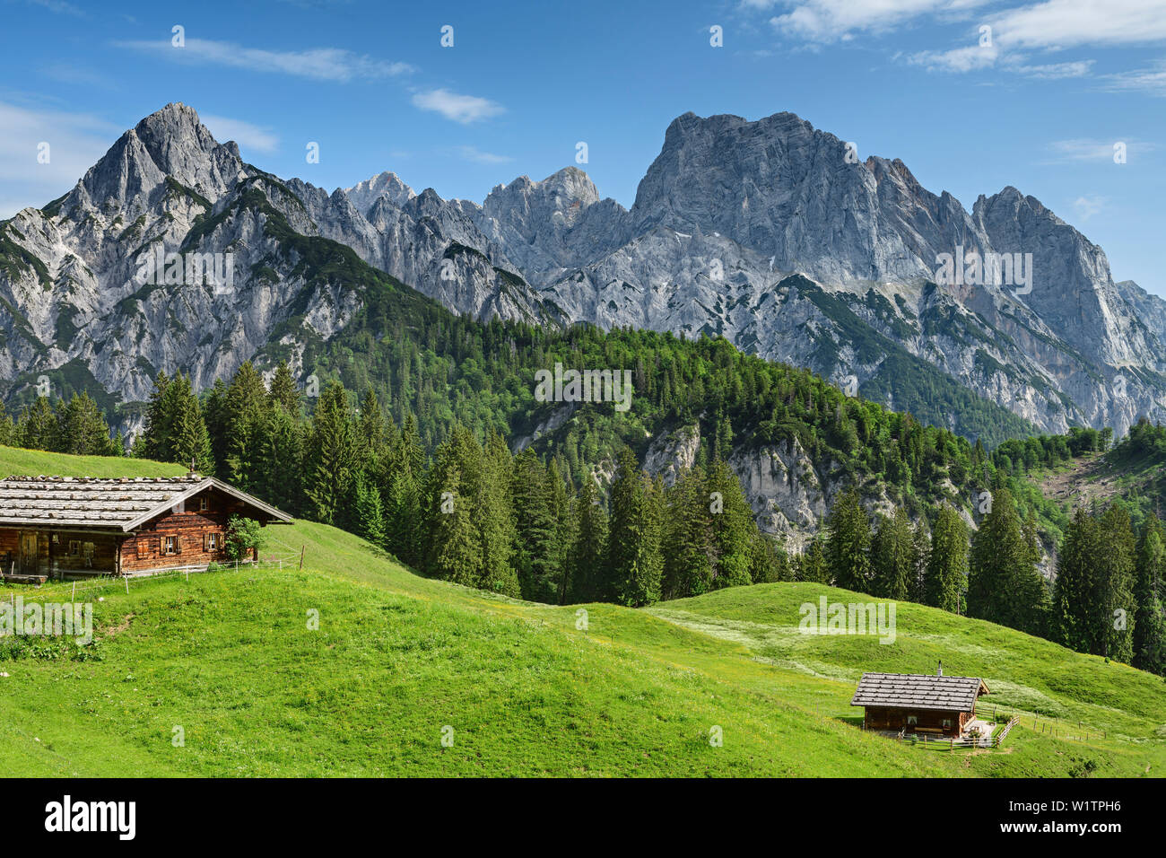 Two alpine huts with rock summits of Reiteralm in background, Berchtesgaden Alps, Salzburg, Austria Stock Photo