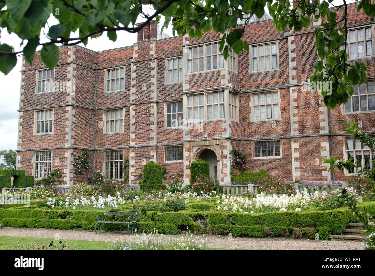 Doddington Hall seen from the Walled West Garden during Iris Week, Doddington Hall and Gardens, Lincolnshire, England, UK Stock Photo