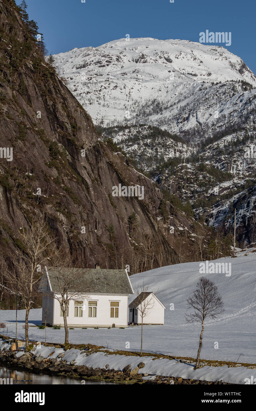 Old Schoolhouse at Mostraumen, Norway, sitting by the Fjord side, Norway, taken from the Bergen to Mostraumen Cruise Stock Photo